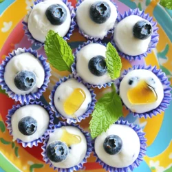 Here’s what you need for your Frozen Blueberry Yogurt Bites: - Fresh blueberries - Greek yogurt - Honey or maple syrup - Vanilla extract - Sea salt - Mini paper cupcake liners or silicone mold These ingredients are simple and easy to find. Fresh blueberries add a burst of flavor and nutrients. Greek yogurt gives a creamy texture and protein. Honey or maple syrup adds sweetness. Vanilla extract gives a nice aroma. A pinch of sea salt balances the flavors. Finally, mini paper cupcake liners or a silicone mold help you shape the bites perfectly. Gather these ingredients before you start. Having everything ready makes the process smooth and fun. Enjoy the ease of making this healthy treat with these simple items! For the full recipe, check out the detailed instructions above. 1. Mixing yogurt and sweeteners Start with a medium bowl. Add 1 cup of plain Greek yogurt. Then, mix in 2 tablespoons of honey or maple syrup. I prefer honey for its rich flavor. Next, add 1 teaspoon of pure vanilla extract and a pinch of sea salt. Stir until smooth and creamy. This step makes the yogurt tasty and rich. 2. Rinsing and drying blueberries Rinse 2 cups of fresh blueberries under cold water. Gently pat them dry with a paper towel. This helps remove dirt and excess moisture. Dry blueberries hold up better in the yogurt. 3. Preparing molds or muffin tin Grab a mini muffin tin. Line it with mini paper cupcake liners. If you prefer, use a silicone mold for easy removal. Both options work well. They help keep the yogurt bites intact. 4. Filling the molds Place a few blueberries in each liner or mold cavity. Try to spread them evenly. This ensures every bite gets a burst of blueberry flavor. Then, spoon the yogurt mixture over the blueberries. Fill each liner until it is about three-quarters full. 5. Freezing the yogurt bites Smooth the tops of each yogurt bite with the back of your spoon. Make sure all blueberries are covered. Now, place the filled muffin tin or mold in the freezer. Let it freeze for at least 4 hours. You want the yogurt bites to be solid. Once frozen, you can enjoy these delicious treats! For more details, check out the Full Recipe. To make your Frozen Blueberry Yogurt Bites perfect, pay attention to these tips: - Achieving a creamy consistency: Start with cold Greek yogurt. Mix it with honey, vanilla, and salt until smooth. Whisking helps blend the ingredients well. This makes your bites creamy and delicious. - Ensuring even blueberry distribution: Use a mini muffin tin or silicone mold. Add a few blueberries to each compartment first. This way, every bite gets blueberries. Then, pour the yogurt mix over them. Make sure to fill each one evenly. - Troubleshooting common issues: If your yogurt bites are too icy, it could be from freezing too long. Try freezing them for just 4 hours. If they stick to the liners, let them sit at room temp for a few minutes before removing. This will help them come out easier. How you serve your bites can make them even more appealing: - Arranging and serving suggestions: Place the frozen yogurt bites on a colorful platter. This brightens up the table. You can also stack them for a fun look. - Garnishing ideas: Add fresh mint leaves on top. This not only looks nice but also gives a refreshing scent. You can also sprinkle some crushed nuts for added texture. These tips will help you create tasty and eye-catching frozen treats that everyone will love! For the recipe, check the Full Recipe. {{image_4}} You can make Frozen Blueberry Yogurt Bites even more fun by changing the flavors. Try adding different fruits like strawberries or raspberries. They bring a new taste and color. You can also experiment with flavored yogurts. Choose vanilla, lemon, or coconut to mix it up. If you like a crunchy bite, add nuts or seeds. Almonds or chia seeds work well. They add texture and extra nutrition. If you want to cut back on sugar, use alternative sweeteners. Options like stevia or agave syrup can be great. They sweeten without adding too many calories. You can also use dairy-free yogurt options. Almond, coconut, or soy yogurt can replace Greek yogurt. This makes the treat friendly for those who avoid dairy. These variations keep your Frozen Blueberry Yogurt Bites healthy and tasty! For the full recipe, check out the Frozen Blueberry Yogurt Bites. To keep your Frozen Blueberry Yogurt Bites fresh, use an airtight container. This will protect them from freezer burn and keep them tasty. I recommend using a container that seals well. You can also use freezer bags. Just remember to remove as much air as you can before sealing. These yogurt bites can last in the freezer for up to two months. After that, they may lose flavor and texture. Make sure to label your container or bag with the date. This helps you track how long they have been stored. When you want to enjoy your Frozen Blueberry Yogurt Bites, simply take out the number you need. Place them in the fridge for about 30 minutes to defrost. This keeps them cool and prevents them from getting too soft. You can also leave them at room temperature for 10-15 minutes if you want a faster option. After thawing, serve the yogurt bites on a pretty plate. You can add fresh mint for extra color and flavor. They make a great snack or dessert. Trust me, they are delicious! Frozen Blueberry Yogurt Bites can last up to two months in the freezer. To keep them fresh, store them in an airtight container. This helps prevent freezer burn and keeps the flavors intact. Yes, you can use frozen blueberries! Just rinse them under cold water before adding them to the yogurt mixture. Frozen blueberries may release more juice, which can change the texture slightly, but they still work well. Greek yogurt is high in protein, which helps you feel full. It also contains probiotics, which are good for your gut health. Plus, it has less sugar than regular yogurt, making it a healthier option. Absolutely! You can prepare these bites a few days in advance. Just freeze them well and take them out shortly before serving. They make a fun and healthy treat for any gathering. You can find pre-made Frozen Blueberry Yogurt Bites in many grocery stores. Look in the frozen dessert aisle. However, making them at home is easy and lets you control the ingredients. For the full recipe, check out the earlier sections! You now have all you need to make delicious frozen blueberry yogurt bites. We covered the best ingredients, easy steps, and how to perfect your treats. I shared tips on storing and serving them too. These bites are simple, healthy, and fun. You can customize them to fit your taste. Enjoy making them for yourself, friends, or family. Get creative, and have fun with your new snack!