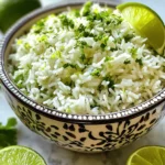 Here’s what you need to make cilantro lime rice. These fresh ingredients will bring bright flavors to your meal: - 1 cup long-grain white rice - 2 cups vegetable broth (or water) - 1 tablespoon olive oil - Juice and zest of 1 fresh lime - 1/2 cup fresh cilantro, finely chopped - 1 garlic clove, minced - 1/2 teaspoon salt (adjust to taste) - 1/4 teaspoon black pepper - Optional: 1/4 teaspoon chili powder (for a spicy kick) Each ingredient plays a key role. The rice forms the base, while the broth adds depth. Olive oil helps with cooking and flavor. Lime brightens the dish, and cilantro brings freshness. Garlic adds a nice savory note. Adjust salt and pepper to match your taste. If you like heat, add chili powder for some extra spice. For the full recipe, check out the details and enjoy making this easy and flavorful side dish! Rinsing the rice: Start by rinsing the long-grain white rice. Use a fine-mesh sieve to wash it under cold water. Keep rinsing until the water is clear. This step removes excess starch, leading to fluffier rice. Sautéing garlic: Next, heat one tablespoon of olive oil in a medium saucepan over medium heat. Add one minced garlic clove. Sauté for about 30 seconds until it smells good. Be careful not to burn the garlic, as it can taste bitter. Toasting the rice: Add the rinsed rice to the pot. Stir well to coat the grains with the garlic oil. Toast the rice for 1-2 minutes. This step enhances the rice's flavor and aroma. Adding liquid and seasonings: Pour in 2 cups of vegetable broth or water. Sprinkle in 1/2 teaspoon of salt, 1/4 teaspoon of black pepper, and if you like, 1/4 teaspoon of chili powder for some heat. Stir gently to mix everything. Bringing to a boil and simmering: Increase the heat to bring the mixture to a boil. Once it boils, lower the heat to low. Cover the pot tightly with a lid and let it simmer for about 15-18 minutes. The rice should be tender and absorb all the liquid. Resting the rice: After cooking, take the pot off the heat but keep it covered. Let it rest for 5 more minutes. This allows the rice grains to firm up and separate nicely. Fluffing the rice: Use a fork to fluff the rice gently. This breaks up any clumps and makes it light. Mixing in lime and cilantro: Now, stir in the juice and zest of one fresh lime and 1/2 cup of finely chopped cilantro. Mix until everything is well combined. Adjusting seasoning: Taste the rice. If you want, add more salt, pepper, or lime juice based on your liking. For the full recipe, check out the detailed instructions above! For a twist, you can swap olive oil for avocado oil or coconut oil. Both oils add unique taste. Fresh ingredients are key. Always use fresh lime and cilantro for the best flavor. To achieve fluffy rice, rinse it well before cooking. This removes extra starch. Cooking time is also important. Keep a close eye and adjust time if needed. If the rice is not tender, add a bit more liquid and cook longer. Garnishing adds beauty to your dish. Use extra cilantro leaves and lime wedges on top. Serve in a colorful bowl for a fun look. Pair the rice with grilled chicken or fish for a complete meal. {{image_4}} You can switch out the rice for other types. Brown rice adds a nutty flavor and more fiber. Jasmine or basmati rice can give it a fragrant touch. Just remember, cooking times may change. Instead of vegetable broth, you can use chicken stock for a richer taste. Stock adds depth and enhances the flavor of the rice. Water works too, but it lacks the extra flavor. To make your rice even more fun, add vegetables. Try mixing in peas, bell peppers, or corn. These colorful veggies not only taste great but also brighten the dish. If you want a spicy kick, sprinkle in some chili powder or cayenne pepper. Start with a little and taste as you go. This way, you can find your perfect heat level. Cilantro lime rice is easy to make vegan and gluten-free. Just use vegetable broth and check your rice brand to ensure it’s gluten-free. This way, everyone can enjoy it! For those watching sodium intake, use low-sodium broth. This simple swap helps keep the dish tasty without too much salt. Keeping an eye on health can still lead to delicious meals. To keep your cilantro lime rice fresh, use a sealed container. Glass or plastic containers work well. Make sure the rice cools to room temperature first. This step helps prevent moisture build-up. Store the rice in the fridge for up to four days. When you reheat, avoid drying out the rice. Use a microwave-safe bowl, add a splash of water, and cover it. Heat it for about one to two minutes. Stir halfway through to ensure even heating. You want the rice warm but not too hot. If you have more rice than you can eat, freezing is a great option. Pack the cooled rice in freezer bags. Try to remove as much air as possible. This keeps the rice from getting freezer burn. You can freeze it for up to three months. To thaw, place the bag in the fridge overnight or use the microwave. Reheat it as explained above. This way, you’ll enjoy great cilantro lime rice anytime! To make Cilantro Lime Rice from scratch, start with rinsing the rice. This helps remove extra starch. Next, sauté minced garlic in olive oil for flavor. Then, toast the rice for a minute or two. It adds depth to the dish. After that, add vegetable broth, salt, and pepper. Bring it to a boil, then cover and simmer until tender. Finally, fluff the rice and mix in lime juice, zest, and chopped cilantro. This process gives you that fresh, zesty flavor you crave. For a detailed guide, check the Full Recipe. Yes, you can use brown rice! It is a healthy option that adds a nutty flavor. Keep in mind that brown rice takes longer to cook. You will need to adjust the liquid and cooking time. Use about 2.5 cups of liquid for every cup of brown rice. Cook it for about 40-45 minutes instead of 15-18 minutes. The result will be just as tasty! Cilantro Lime Rice goes well with many dishes. It complements tacos, burritos, and grilled chicken. You can serve it alongside shrimp or fish for a fresh twist. It also pairs nicely with beans for a vegetarian meal. This rice adds a bright touch to any plate! Leftover Cilantro Lime Rice can last in the fridge for about 3-4 days. Store it in an airtight container to keep it fresh. If you want to keep it longer, consider freezing it. Frozen rice can last up to 2 months. Just thaw it in the fridge before reheating! Cilantro lime rice is simple yet tasty. We started by listing ingredients and then followed easy steps to cook. Enhancing flavors, adjusting texture, and creative serving can make this dish shine. You can mix in different ingredients or swap rice types based on your needs. Storing leftovers and reheating properly will keep flavors fresh. Remember, with this guide, you can make a delicious rice dish that fits your taste. Enjoy cooking and customizing this recipe to suit your meals. Trust me, it will be a hit!