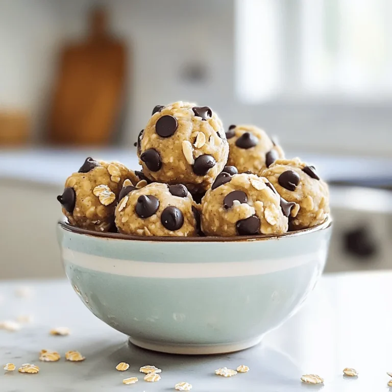 To make No-Bake Cookie Dough Protein Bites, you will need a few simple ingredients. Here’s what you will need: - 1 cup almond flour - 1/2 cup rolled oats - 1/4 cup protein powder (vanilla or chocolate) - 1/3 cup maple syrup or honey - 1/4 cup peanut butter or almond butter - 1 teaspoon vanilla extract - 1/4 cup mini dark chocolate chips - Pinch of salt These ingredients come together to create a tasty treat. Almond flour gives the bites a nice texture. Rolled oats add some chewiness. Protein powder boosts the protein content, making these bites perfect for a snack. You can choose either maple syrup or honey for sweetness. Both options work well. The nut butter gives a rich flavor and creamy texture. Vanilla extract adds a warm aroma, while the salt enhances all the flavors in the bites. Finally, mini dark chocolate chips provide delightful bursts of chocolate with every bite. In a large mixing bowl, combine the almond flour, rolled oats, and protein powder. Stir until they mix well. This step helps build the base for your bites. Almond flour gives a nutty taste, while oats add texture. You can choose either vanilla or chocolate protein powder based on your preference. Now, add the maple syrup, peanut butter, vanilla extract, and a pinch of salt to the bowl. Mix these wet ingredients into the dry ones. Keep stirring until a sticky dough forms. The dough should feel a bit tacky but easy to handle. The maple syrup adds sweetness, while the peanut butter gives the bites a creamy texture. Next, gently fold in the mini dark chocolate chips. Make sure they spread evenly throughout the dough. This step adds pops of chocolate flavor. You can use more or less chocolate depending on your taste. These mini chips are key for that cookie dough taste! Using your hands, scoop out portions of the dough. Roll each portion into a ball, about one inch in size. Aim for uniform balls to make them look nice. This step is fun and allows you to get hands-on with your food. Each bite will be perfectly sized for snacking! Place the cookie dough bites on a parchment-lined baking sheet. Make sure they are spaced apart to prevent sticking. This is an important step so they don’t merge together in the fridge. You can also use a plate if you prefer. Finally, refrigerate the bites for at least 30 minutes. This helps them set and hold their shape. Chilling makes the bites firmer and easier to eat. You can enjoy them right after chilling, or store them for later. They will be ready to fuel your day! To get the right texture, the dough should be sticky but still easy to handle. Start with the dry ingredients. Mix almond flour, oats, and protein powder well. Then, add your wet ingredients. Use maple syrup or honey and peanut butter. Mix until the dough holds together. If it's too dry, add a little more syrup or nut butter. If it's too wet, add a bit more almond flour. You want a dough that sticks together but does not cling to your hands. To make your cookie dough bites look great, presentation matters. Use a small bowl or platter to show them off. Arrange the bites in a circle or in rows. For a fun touch, sprinkle extra chocolate chips or oats on top. This not only looks nice but also adds a little extra flavor. You can even use colorful cupcake liners for a pop of color. This makes them feel more special! Sweetness can vary based on your taste. If you want a sweeter treat, add more honey or maple syrup. Start with the suggested amount. Then, taste the dough before rolling it into balls. If you feel it needs more sweetness, go ahead and add a little more. You can also use flavored protein powder, like vanilla or chocolate. This adds a nice touch and can change the sweetness too. {{image_4}} You can change the taste of these bites by using different protein powders. If you like chocolate, opt for chocolate protein powder. For a lighter flavor, try vanilla. You can even mix protein flavors for a fun twist. This way, you can tailor each batch to your mood or cravings. If you don’t have almond butter, try peanut butter. It adds a rich flavor that pairs well with chocolate chips. You can also use sunbutter if you want a nut-free option. This works great for those with nut allergies. Each nut butter gives the bites a unique taste and texture. Get creative with add-ins! Dried fruits like cranberries or raisins boost the flavor and nutrition. You can also toss in nuts such as walnuts or pecans for crunch. These add-ins make the bites more exciting and fun. Don’t be afraid to mix and match to find your favorite combination! To keep your No-Bake Cookie Dough Protein Bites fresh, use airtight containers. These containers protect the bites from air and moisture. Make sure to seal them well after each use. This step helps maintain their taste and texture for longer. When stored in the fridge, these bites stay fresh for up to a week. After that, they may lose their flavor and texture. Always check for any signs of spoilage, such as off smells or changes in texture. If you want to keep your protein bites longer, freezing is a great option. To freeze, place them in a single layer on a baking sheet first. Once frozen, transfer them to an airtight container or freezer bag. They can last up to three months in the freezer. When you're ready to enjoy them, thaw the bites in the fridge overnight for the best results. Yes, these protein bites are healthy! They are packed with nutrients. Here’s a quick look at the benefits: - Protein: The protein powder adds a good amount of protein. This helps with muscle recovery and keeps you feeling full. - Healthy Fats: Almond flour and nut butter provide healthy fats. These fats support heart health and brain function. - Fiber: Rolled oats contribute fiber. Fiber aids digestion and helps keep you satisfied longer. - Natural Sweetness: Using maple syrup or honey gives natural sweetness. This is better than refined sugar options. These bites are a great snack or meal boost! Yes, you can use other flours! Almond flour is popular, but here are some good swaps: - Oat Flour: You can make this by grinding rolled oats. It adds a mild flavor. - Coconut Flour: This flour is low in carbs. Use less than almond flour, as it absorbs more moisture. - Whole Wheat Flour: This is a healthier option than white flour. It adds fiber but may change the taste slightly. Choose a flour that fits your diet and taste! These bites are quick to prepare! The total time is about 40 minutes. Here’s the breakdown: - Prep Time: It takes about 10 minutes to mix the ingredients. - Chill Time: Refrigerate the bites for at least 30 minutes. This helps them firm up and hold shape. You’ll have tasty bites ready in no time! Yes, making these bites vegan is easy! Here are some simple adjustments: - Protein Powder: Use a vegan protein powder, like pea or brown rice. - Nut Butter: Almond butter and peanut butter are usually vegan. Just check the label. - Sweetener: Maple syrup is vegan. If you prefer, agave syrup is a good alternative. With these swaps, everyone can enjoy these bites! These no-bake cookie dough protein bites are simple and fun to make. You combine dry and wet ingredients, add chocolate chips, and shape them into balls. With tricks for texture and ways to customize flavors, you can create a treat that suits your taste. Store them well to enjoy them longer. Don't forget, they can also fit into a healthy lifestyle. Now, it’s time to mix, shape, and enjoy your own delicious bites!