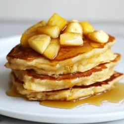 To make these tasty pancakes, gather these core ingredients: - 1 cup rolled oats - 1 ripe banana - 1 cup milk of choice (dairy or plant-based) - 1 scoop vanilla protein powder - 1 teaspoon ground cinnamon - 1 tablespoon baking powder - 1/2 teaspoon vanilla extract - 1 medium apple, peeled and diced - A pinch of salt - Coconut oil or non-stick cooking spray for frying These ingredients work together to create a fluffy, nutritious pancake that packs a protein punch. The oats provide fiber, while the banana adds natural sweetness. The diced apple gives each bite a fresh crunch. You can enhance your pancake experience with these optional toppings: - Organic maple syrup - Extra diced apples for crunch - Ground cinnamon for added flavor - A dollop of Greek yogurt - Nut butter for richness These toppings not only add flavor but also boost nutrition. For example, Greek yogurt offers extra protein, while nut butter provides healthy fats. Each serving of these pancakes is packed with nutrition. You can expect: - Calories: Approximately 350 - Protein: 20 grams - Carbohydrates: 50 grams - Fiber: 7 grams - Fat: 8 grams These pancakes give you energy to start your day. They are perfect for breakfast or even a post-workout meal. The balance of protein, carbs, and healthy fats makes them a smart choice for any meal. {{ingredient_image_2}} To start, grab a high-speed blender. Add 1 cup of rolled oats and 1 ripe banana. Pour in 1 cup of your choice of milk. You can use dairy or plant-based milk. Next, add 1 scoop of vanilla protein powder and 1 teaspoon of ground cinnamon. Don&rsquo;t forget 1 tablespoon of baking powder and a pinch of salt. Blend this mixture on high until it is smooth and creamy. After blending, pour the batter into a mixing bowl. Now, fold in 1 medium apple, peeled and diced. Make sure the apple pieces are spread evenly throughout the batter. This helps ensure each bite is full of flavor. Next, preheat a non-stick skillet over medium heat. Lightly grease the pan with coconut oil or non-stick cooking spray. This step keeps the pancakes from sticking. For each pancake, pour about 1/4 cup of batter into the hot skillet. Cook for 2-3 minutes. Watch for small bubbles to form on the surface. When you see them, it's time to flip the pancake. Use a spatula for this. Cook the other side for another 2-3 minutes until it turns golden brown. Transfer the cooked pancakes to a warm plate. Repeat this process with the rest of the batter. Adjust the heat if needed to prevent burning. Serve the pancakes warm for the best taste. Drizzle some organic maple syrup over the top. You can also add extra diced apples for crunch. A light sprinkle of ground cinnamon enhances the flavor. For a more filling meal, consider adding a dollop of Greek yogurt or nut butter. Arrange the pancakes in a stack on a serving plate. Garnish with a few apple slices and a dusting of cinnamon for a pretty look. Enjoy your tasty and nutritious breakfast! To get the best pancake texture, blend the batter well. Use a high-speed blender to mix the rolled oats, banana, and milk. This makes the batter smooth and creamy. If the batter is too thick, add a bit more milk. If it&rsquo;s too thin, add a little more oats. Let the batter rest for a few minutes. This helps the oats absorb some liquid. Use a non-stick skillet or a griddle for cooking. Preheat it on medium heat. A hot pan helps the pancakes cook evenly. Lightly grease the pan with coconut oil or cooking spray. Pour about 1/4 cup of batter for each pancake. Cook until you see bubbles on the surface. Then flip and cook until golden brown. You can adjust the sweetness by using different toppings. Maple syrup adds a nice touch. Diced apples give natural sweetness. If you want less sugar, skip the syrup. You can also add a bit more cinnamon for extra flavor. Taste the batter before cooking. This way, you can tweak it to your liking. Pro Tips Use Fresh Apples: Opt for crisp, fresh apples like Granny Smith or Honeycrisp for a perfect balance of sweetness and tartness in your pancakes. Adjusting Thickness: If you prefer thicker pancakes, reduce the amount of milk slightly or add a bit more oats to the batter. Keep Pancakes Warm: To keep pancakes warm while cooking the rest, place them on a baking sheet in a low oven (around 200&deg;F or 90&deg;C). Protein Variations: Feel free to experiment with different flavors of protein powder, such as cinnamon or apple pie, to enhance the taste of your pancakes. {{image_4}} You can easily make these pancakes gluten-free. Just swap the rolled oats for certified gluten-free oats. This change keeps the taste and texture delightful. You still get that lovely apple and cinnamon flavor. The pancakes will remain fluffy and filling. Enjoy them guilt-free! To make these pancakes vegan, use plant-based milk, like almond or oat milk. Replace the egg with an extra banana or a flax egg. A flax egg is made by mixing one tablespoon of ground flaxseed with two and a half tablespoons of water. Let it sit for a few minutes until it thickens. This keeps the pancakes moist and tasty. Add some nuts or seeds for a nice crunch! Walnuts, pecans, or chia seeds work great. Chop the nuts finely and mix them into the batter. This extra step adds texture and boosts the nutrition. It gives you healthy fats and protein in each bite. Enjoy your pancakes with a delightful twist! After making your apple cinnamon protein pancakes, you may have some left. To store them, let the pancakes cool to room temperature. Then, stack them with a layer of parchment paper between each one. Place the stack in an airtight container. They will stay fresh in the fridge for about three days. This method keeps them from sticking together. If you want to save pancakes for later, freezing works great. First, cool the pancakes completely. Then, place them in a single layer on a baking sheet. Freeze them for about an hour. This step prevents them from sticking together. Once frozen, transfer the pancakes to a freezer bag. They can last up to three months in the freezer. Label the bag with the date so you remember when you made them. To enjoy your pancakes again, reheat them for the best flavor. If they are in the fridge, use a microwave. Heat them for about 30 seconds. Check if they are warm enough, and add more time if needed. If they are frozen, microwave them for about 1-2 minutes. You can also reheat them in a skillet. Heat the skillet over medium-low heat, and cook each pancake for about 1-2 minutes per side. This method makes them taste fresh again. Enjoy! Yes, you can! Try bananas, blueberries, or even peaches. Each fruit will give a unique taste. Just make sure to chop the fruit into small pieces for even cooking. You can mix and match fruits based on what you like. I suggest using vanilla protein powder. It adds a nice flavor that pairs well with apples and cinnamon. You can also use plant-based protein if you prefer. Look for a powder with no added sugars for the best results. To make sugar-free pancakes, skip any sugar or sweeteners. The ripe banana adds natural sweetness. You can also use unsweetened applesauce as a sweetener. This keeps the pancakes tasty without added sugar. To make delicious apple cinnamon protein pancakes, gather key ingredients like oats and protein powder. Prepare the batter and cook with care for the best texture. Try fun toppings, and even go gluten-free or vegan if you&rsquo;d like. Store leftovers well or freeze them for quick meals. Use our tips to customize sweetness and flavor. Enjoy these pancakes as a tasty way to fuel your day while trying different variations to keep things fresh. Your breakfast just got better!