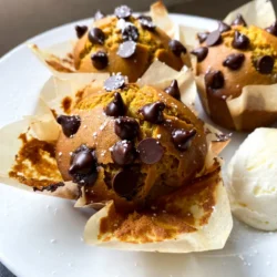 To make these delightful muffins, gather the following ingredients: - 1 cup canned pumpkin puree - 1/2 cup vegetable oil - 1/2 cup packed brown sugar - 1/2 cup granulated sugar - 2 large eggs - 1 teaspoon vanilla extract - 1 &frac12; cups all-purpose flour - 1 teaspoon baking powder - 1 teaspoon baking soda - 1 teaspoon ground cinnamon - 1/2 teaspoon ground nutmeg - 1/4 teaspoon ground ginger - 1/4 teaspoon salt - 1 cup semi-sweet chocolate chips You can easily swap some ingredients. For oil, use applesauce or melted coconut oil. For sugar, try coconut sugar or a sugar alternative. You can also use gluten-free flour for a gluten-free option. Just ensure that it is a 1:1 blend for the best results. These swaps can keep your muffins tasty and still soft. For pumpkin puree, I recommend Libby's or Farmer's Market Organic brands. They offer rich flavors and smooth textures. For chocolate chips, Ghirardelli or Nestl&eacute; Toll House are great choices. Their semi-sweet chips melt perfectly and add a nice sweetness to the muffins. Quality ingredients make all the difference in your baking! {{ingredient_image_2}} To make these tasty muffins, start by preheating your oven to 350&deg;F (175&deg;C). Get your muffin tin ready by lining it with paper liners or greasing each cup with butter or cooking spray. In a large bowl, mix 1 cup of pumpkin puree, 1/2 cup of vegetable oil, 1/2 cup of brown sugar, and 1/2 cup of granulated sugar. Whisk until smooth. Next, add 2 large eggs one at a time, mixing well after each addition. Stir in 1 teaspoon of vanilla extract. In a separate bowl, sift together 1 &frac12; cups of all-purpose flour, 1 teaspoon of baking powder, 1 teaspoon of baking soda, 1 teaspoon of ground cinnamon, 1/2 teaspoon of ground nutmeg, 1/4 teaspoon of ground ginger, and 1/4 teaspoon of salt. Slowly mix the dry ingredients into the wet mixture, stirring gently until just combined. Be careful not to overmix. Finally, fold in 1 cup of semi-sweet chocolate chips and set aside a handful for topping. Spoon the batter into the muffin cups, filling each about 2/3 full. Sprinkle the reserved chocolate chips on top of each muffin. Bake in the oven for 18-22 minutes. Insert a toothpick into the center of a muffin to check if it's done. If it comes out clean, your muffins are ready. After baking, let them cool in the pan for about 5 minutes. Then, transfer them to a wire rack to cool completely. When preparing your muffin tin, use paper liners for easy cleanup. If you prefer greasing, use a light hand with butter or cooking spray. This helps muffins release easily without sticking. For the batter, mix gently. Overmixing can make muffins dense. Use a spatula or wooden spoon for a smooth mix. If you want a fun twist, add nuts or dried fruit into the batter. To check if your muffins are done, use a toothpick. Insert it into the center of a muffin. If it comes out clean or with a few crumbs, they are ready. If the toothpick has wet batter on it, bake for another 2-3 minutes. Keep an eye on your muffins as they bake. Each oven can be different. Enjoy the warm smell of pumpkin and chocolate as they bake! To bake the best muffins, avoid mixing too much. When you combine wet and dry ingredients, mix gently. Overmixing can make your muffins tough. Also, do not skip the sifting step for dry ingredients. It adds air and helps your muffins rise. Another mistake is underfilling the muffin cups. Fill them about 2/3 full for the perfect rise. If you fill them too high, they may overflow. And do not forget to check your oven temperature. An oven that is too hot can burn the tops before the inside cooks. For soft and fluffy muffins, use room temperature eggs. Cold eggs can make the batter lumpy. Also, using canned pumpkin puree adds moisture and flavor. I recommend using high-quality chocolate chips for a rich taste. Adding spices like cinnamon, nutmeg, and ginger creates warmth in flavor. Adjust the spices to fit your taste. If you like more spice, add a bit more cinnamon or nutmeg. The key is to balance flavors to enhance the pumpkin. To keep your muffins fresh, store them in an airtight container. This helps prevent them from drying out. If you want to keep them longer, freeze them. Wrap each muffin in plastic wrap before placing them in a freezer bag. This keeps them fresh for up to three months. When you are ready to enjoy, let them thaw at room temperature. You can also reheat them in the oven for a few minutes. This restores their soft texture and warm flavor. Pro Tips Use Fresh Spices: For the best flavor, use fresh ground spices instead of pre-ground ones. This enhances the aroma and taste of your muffins. Don&rsquo;t Overmix: When combining the wet and dry ingredients, mix until just combined to keep the muffins light and fluffy. Chocolate Chip Variations: Experiment with different types of chocolate chips or even add nuts for added texture and flavor. Proper Cooling: Allow muffins to cool in the pan for a few minutes before transferring to a wire rack to prevent them from becoming soggy. {{image_4}} You can easily add nuts or dried fruits to your chocolate chip pumpkin muffins. Nuts like walnuts or pecans add a nice crunch. Simply chop them up and fold them into the batter with the chocolate chips. Dried fruits like cranberries or raisins bring a sweet twist. Use about half a cup of your chosen ingredient for a good balance. This will give your muffins more flavor and texture. Want to spice up your muffins? You can add more flavor with spices or extracts. Try adding a pinch of cloves or allspice for warmth. You can also add a teaspoon of almond or orange extract for a unique twist. This small change can really boost the taste. Experiment with different combinations to find your favorite blend. If you're looking for a healthier version, you have options. You can reduce the sugar by using only brown sugar or using a sugar substitute. For a gluten-free version, swap all-purpose flour with almond flour or a gluten-free blend. These changes make the muffins lighter while still keeping them tasty. You can enjoy the same great flavors with fewer calories or gluten. To keep your Chocolate Chip Pumpkin Muffins fresh, store them in an airtight container. This step helps lock in moisture and flavor. You can place a paper towel at the bottom of the container. This towel absorbs any extra moisture. Keep your muffins at room temperature for up to three days. If you want to store them for longer, the fridge can work too. Just remember, refrigeration can dry them out faster. So, only use this method if you need to extend their life. Freezing muffins is simple. Wrap each muffin in plastic wrap. Then, place them in a freezer bag. Make sure to squeeze out excess air to prevent freezer burn. You can freeze them for up to three months. When it's time to enjoy a muffin, take it out and let it thaw. For a warm treat, reheat it in the microwave for about 15-20 seconds. You can also pop it in the oven at 350&deg;F for about 10 minutes. This method will refresh the muffin's soft texture. Chocolate Chip Pumpkin Muffins can last about three days at room temperature and up to a week in the fridge. Check for signs of spoilage before eating. Look for mold, an off smell, or a dry texture. If any of these appear, it&rsquo;s best to toss them. Always trust your senses when it comes to food safety. Yes, you can use fresh pumpkin. Start by roasting a pumpkin until it's soft. Then, scoop out the flesh and blend it until smooth. This fresh pumpkin gives a great taste and nice texture. Just make sure to measure it as you would the canned puree. Fresh pumpkin may have slightly more water, so you might need to adjust the flour a bit. To keep your muffins moist, use the right amount of oil and sugar. The combination of brown sugar and granulated sugar helps add moisture. Mixing the wet ingredients well also makes a difference. Avoid overmixing the batter; this keeps the muffins fluffy. Finally, do not bake them too long. Check for doneness with a toothpick to ensure they stay soft inside. Yes, you can make the batter in advance. Just mix the wet and dry ingredients separately, then combine them when you're ready to bake. Store the wet mix in the fridge for up to 24 hours. When you&rsquo;re ready, add the dry mix and chocolate chips. This method gives you fresh muffins without a lot of prep time. You learned how to make Chocolate Chip Pumpkin Muffins from scratch. We covered the best ingredients, step-by-step instructions, and common mistakes. I shared tips on customizing and storing them for freshness. Remember, you can use alternatives if you need them. Baking these muffins is easy and fun. With practice, you'll make the best muffins ever! Enjoy your tasty treats, and don&rsquo;t be afraid to experiment with flavors. Happy baking!
